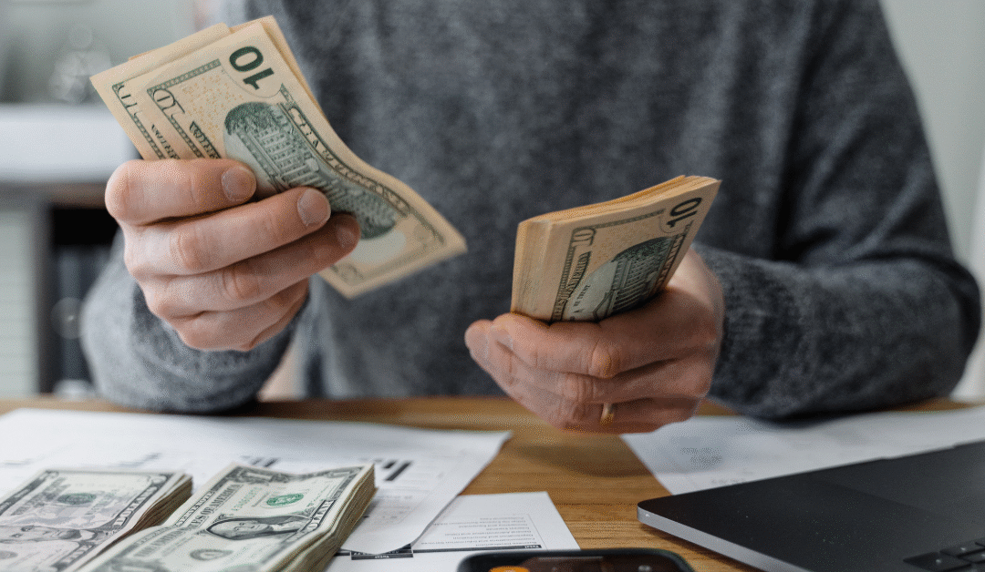 Small business owner paying themselves first to build a sustainable, profitable business